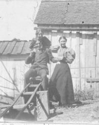 Charlie, Emma, and Ida Cook in W.B. Cook's yard