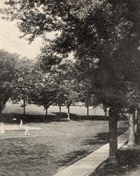 Students playing lawn tennis at Normal Park