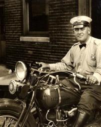 Officer Truman Logan on motorcycle with sidecar, 1931