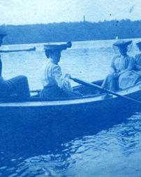 Unidentified man and three unidentified women in boat