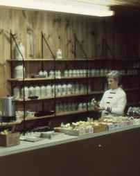 Woman Behind Maple Products Counter at Festival Park