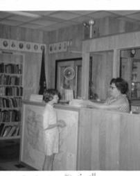 Ebensburg Public Library - Child checks out books