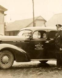 Sgt. Theodore R. Walters with radio car, 1938