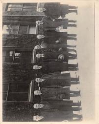 Group of Men In Front of the Steel Mill