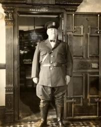 Patrolman Oscar Reed in front of Treasurer's Office, 1931