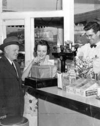 Mailing a package at McMurray Dairy Bar, 1957.
