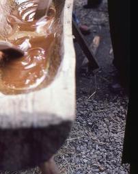 Close-up of Stirring in Maple Sugar Trough