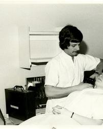 Photo of a patient with a technician.