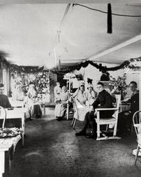 Red Cross nurses and servicemen in canteen