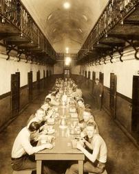 Prisoners seated at "new" tables, 1932