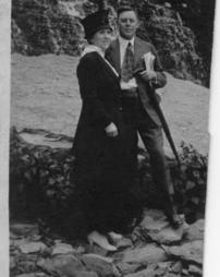 Louise and William S. Livengood standing on rocks with waterfall in background