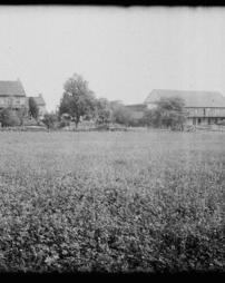 Unidentified field and farmhouses