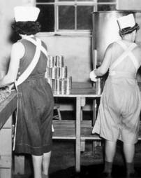 Inmates using the industrial canner at the State Industrial Home for Women (Muncy, Pa.)