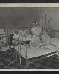 Nurse and patients in a children's ward