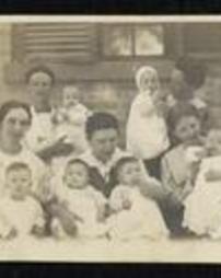 Photograph of missionary women with infants.