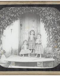 [Three Girls in Front of House]