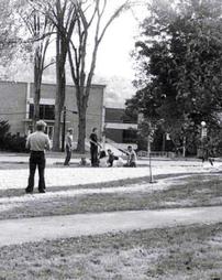 Students walking in front of Ward Hall towards Miller Library