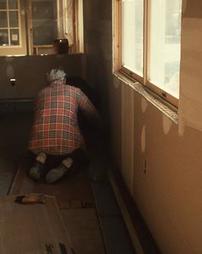 Man Installs Baseboard Heating