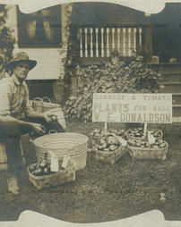 Walter Donaldson selling produce, early 1900s.