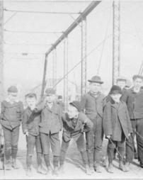 Thirteen boys on a bridge