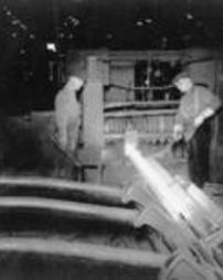 Men working in a rolling mill