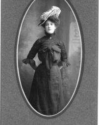 Grace Weakland wears a large hat
