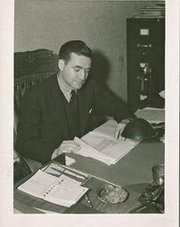 President Byron S. Hollinshead at his desk 1936-1937
