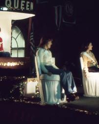 Maple Queen Susan Bodes on Float in Night Parade