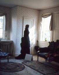 Silhouette of Woman in Maple Manor Upstairs Parlor
