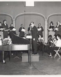 Richard D. Wetzel with singers and mucians