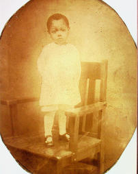 Small child standing on chair