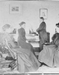 Women sitting calmly at J.M. Olinger's residence