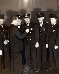 Firemen presented with First Aid certificates, April, 1941