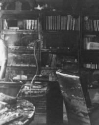 Geological Survey - State Geologist, Arthur Socolow, surveying the damage in his office after the Hurricane Agnes flood