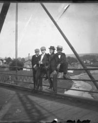 Four boys on a bridge