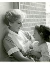 A nurse and child.