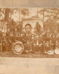 Band in Uniform Seated in Front of Pavilion