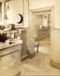 Harvey Zuber manning desk at Police Headquarters, 1933