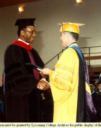 Dr. Blumer Congratulates Reverend Felton May, Commencement 1989
