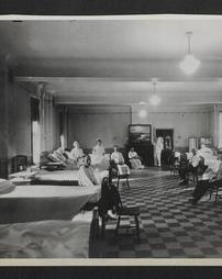 Group of nurses and patients in a hospital ward