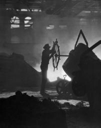 Man pouring steel in a Pittsburgh steel mill