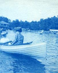 Two unidentified women and one unidentified man in boat