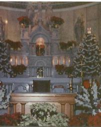 Flowers and Christmas tree at the altar of Sts. Casimir and Emerich Church