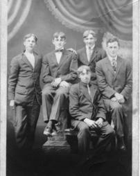 Five young men in suits