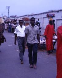 Locals walk through street market