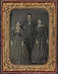 Portrait of Two Women and a Man