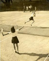 Two students play tennis, 1945