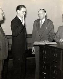 Henry F. O'Connor being sworn in as policeman