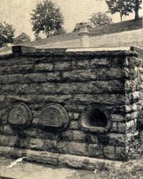 Fireman's Tomb: The Pursell vault is ventilated by the chimney shown on the roof.