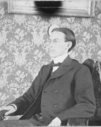 C.C. Cook sitting in chair